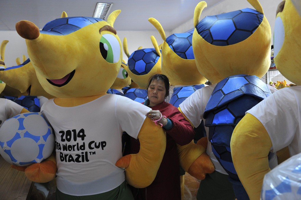 A million versions of Fuleco the Armadillo, the official mascot of the 2014 Fifa World Cup, are being produced in a factory in Tianchang, Anhui province. Photo: AFP
