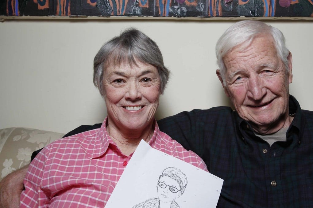 Bonnie Raines, with her husband John, holds a 1971 FBI drawing of herself. Photo: AP