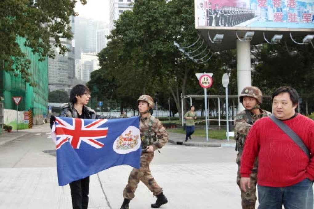 PLA soldiers stop protesters at the barracks. Photo: SCMP