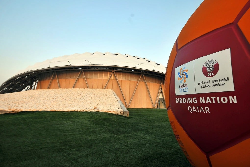The FIFA 2022 World Cup bid logo in front of a showcase stadium built with zero carbon, solar-powered cooling technology for open-air stadiums in Doha, Qatar. Photo: EPA