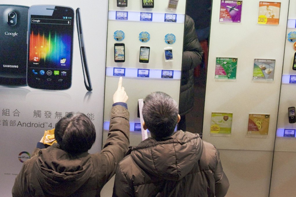 With the likelihood of one less player in the market, the outlook is improving for the four remaining mobile operators. Photo: Bloomberg