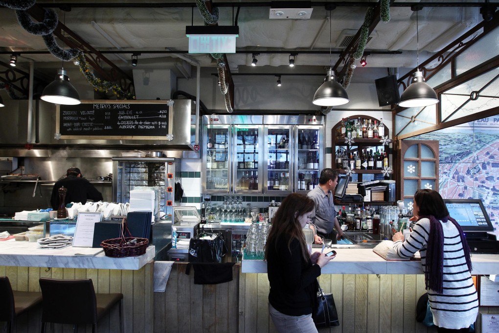 The bar and open kitchen at The Metropolitain. Photo: Jonathan Wong