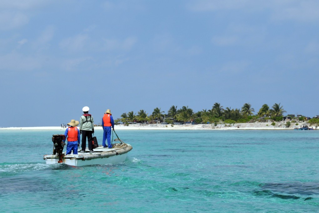 Staff members of China Marine Surveillance (CMS) head for Zhaoshu Island in Sansha City, south China's Hainan Province, March 10, 2013. Photo: Xinhua