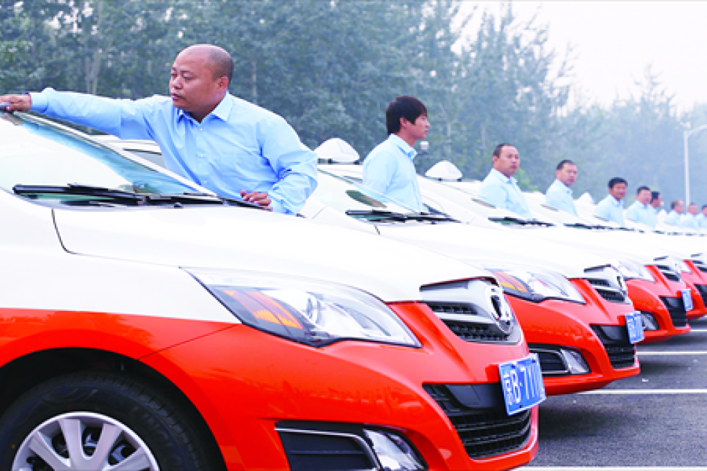 A group of electric taxis lined up in the Tongzhou district of Beijing. Photo: CFP, via Global Times