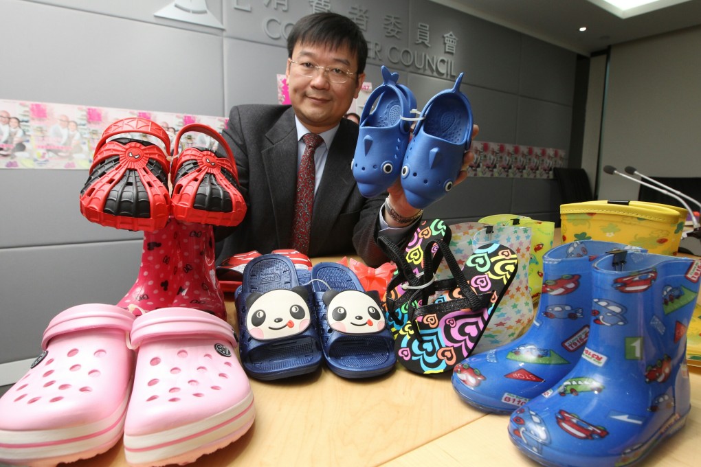 Prof. Ron Hui, from the Consumer Council, displays some of the plastic shoe samples. Photo: Edward Wong