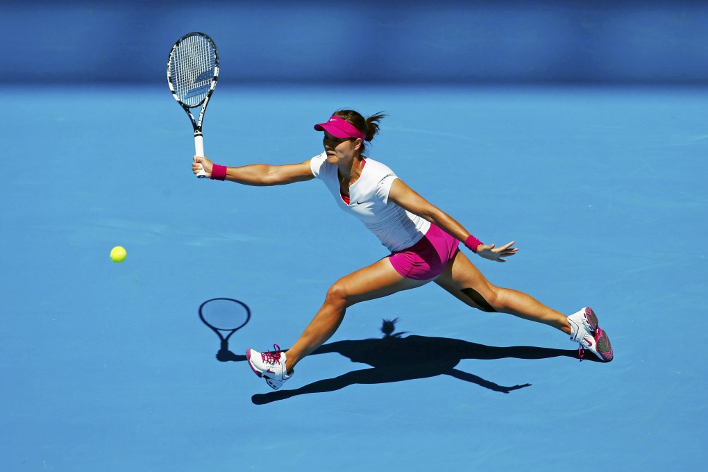 Li Na of China hits a return to Ana Konjuh of Croatia during their singles match in the first round of the Australian Open in Melbourne. Photo: Reuters