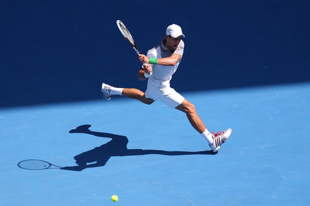 Second-seeded Novak Djokovic hits a return against Argentina's Leonardo Mayer at Melbourne Park. Photo: Reuters