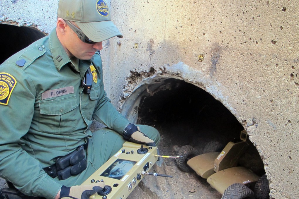 A robot is used to navigate a US border drainage canal. Photo: AP