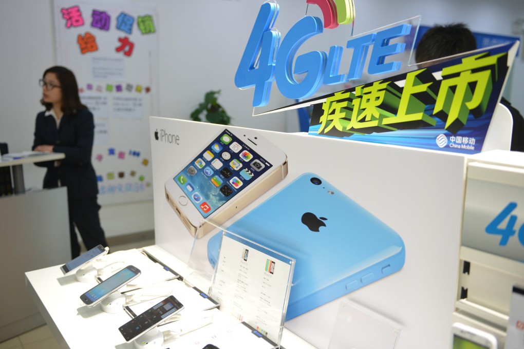 Apple's iPhone is promoted in a China Mobile store in Shanghai earlier this week, before its mainland release by the world's largest network operator. Photo: AFP