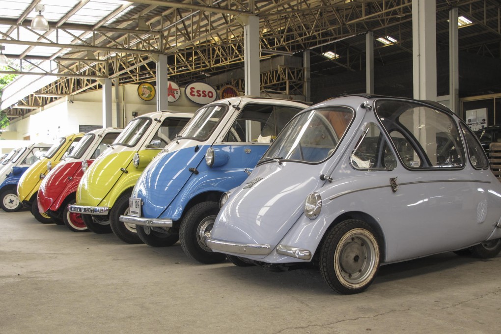 A row of microcars at the Jesada Technik Museum in Salaya, Thailand.