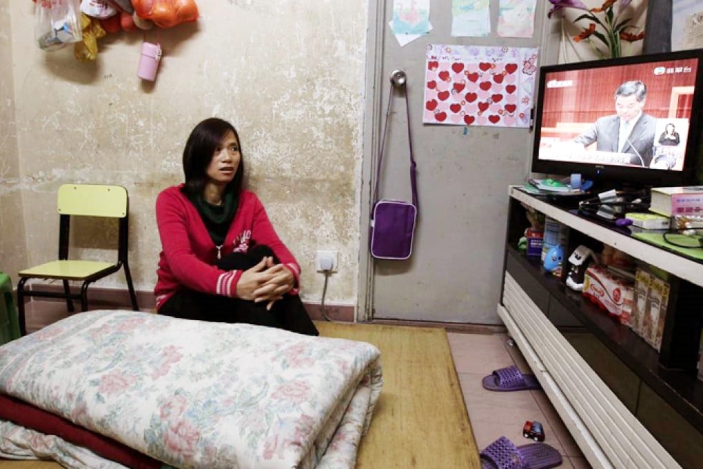 Du Runxing,  who lives in the subdivided flat in Sham Shui Po with her family, hopes CY Leung can tell when they can move to a public housing flat. Photo: Dickson Lee