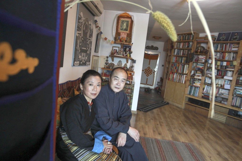 Tsering Woeser, with her husband, Wang Lixiong, at their home in Beijing. Photos: Simon Song; Corbis; AFP