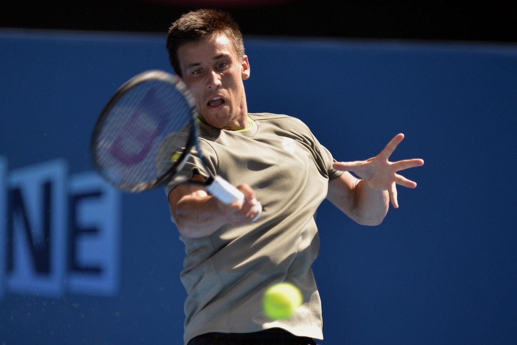 Damir Dzumhur of Bosnia and Herzegovina returns to Tomas Berdych of the Czech Republic during their third-round match at the Australian Open on Friday. Photo: EPA