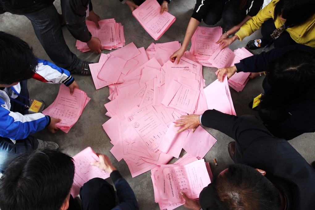 Ballots lie on the floor after the village committee election in March 2012 in Wukan. Photo: Felix Wong