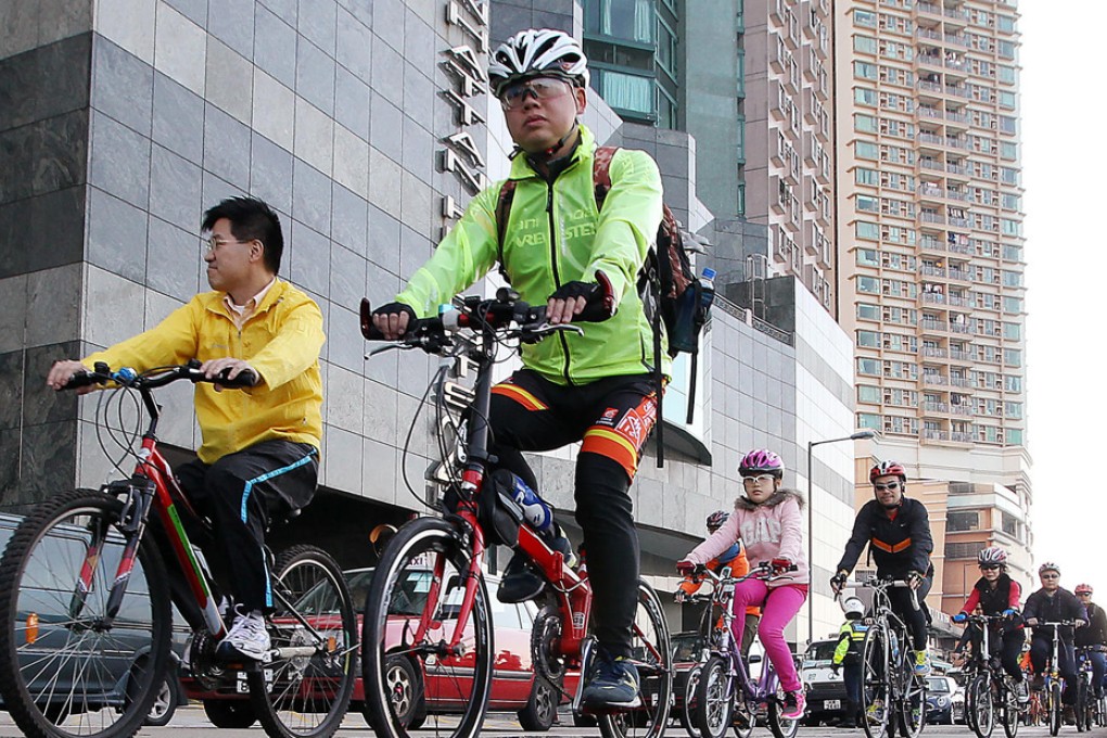 About 1,000 cyclists rolled up for the Harbourfront Bike Ride. They pedalled from Kennedy Town to Sai Wan Ho, close to a proposed route for a bike path, but were forced to travel on roads far from the water for much of the journey. Photo: Felix Wong