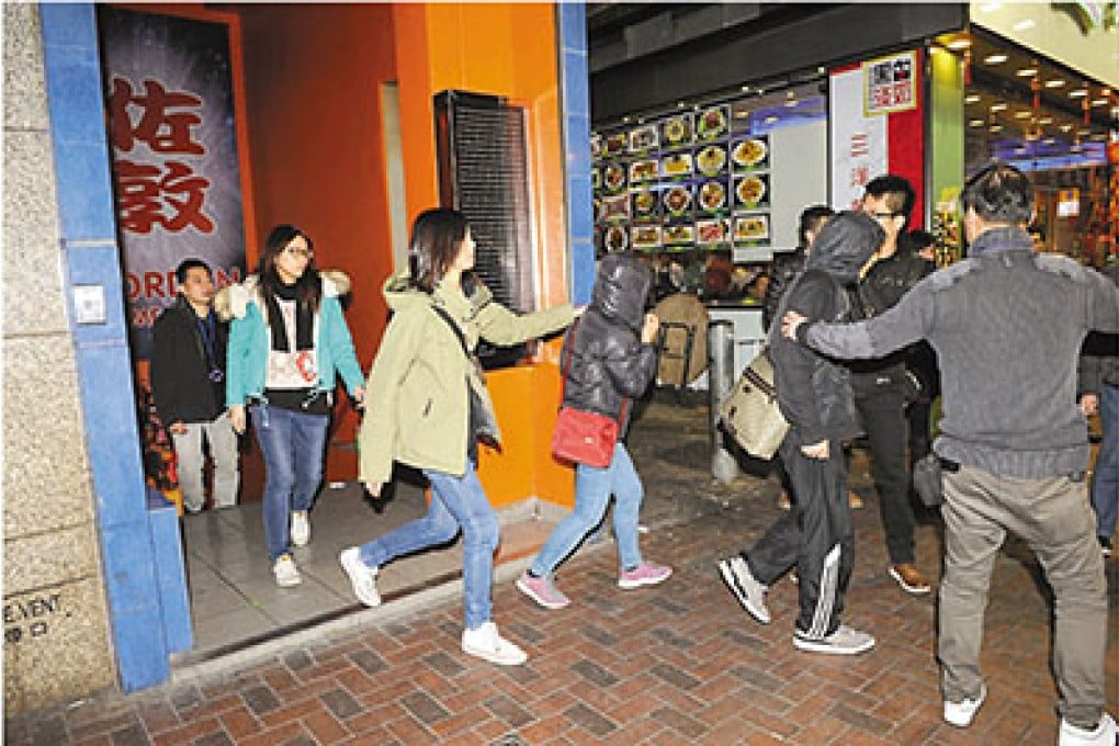 Police arrest 40 in raid on Yau Ma Tei gambling den in games arcade