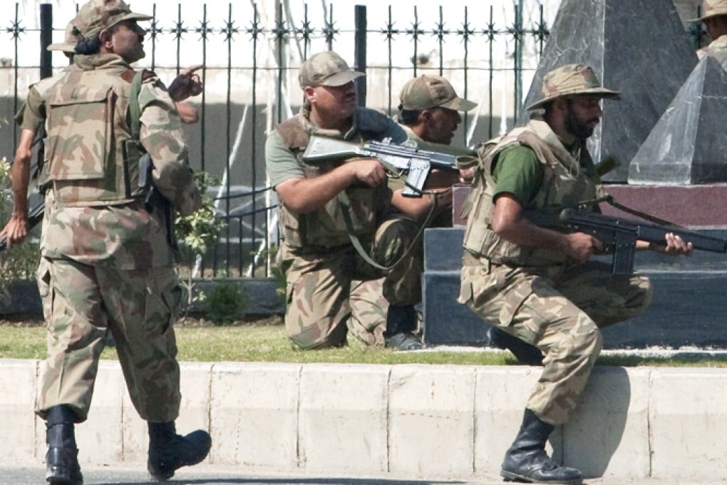 Soldiers outside the main gate of the Pakistan army headquarters in Rawalpindi. Ten were killed by a suicide bomber near the headquarters. Photo: Reuters