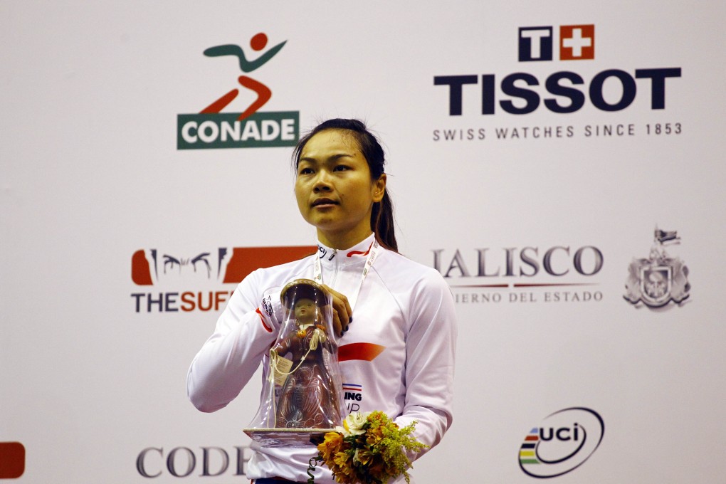 Sarah Lee poses with her trophy on the podium after winning the keirin final in Mexico. Photo: AFP