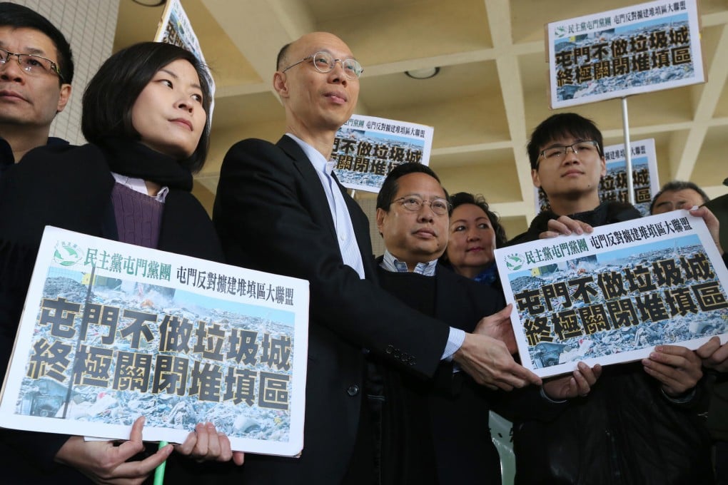 Secretary for the Environment Wong Kam-sing (third from left) receives petitions from lawmaker Albert Ho Chun-yan (to his left) and protesters. Photo: David Wong