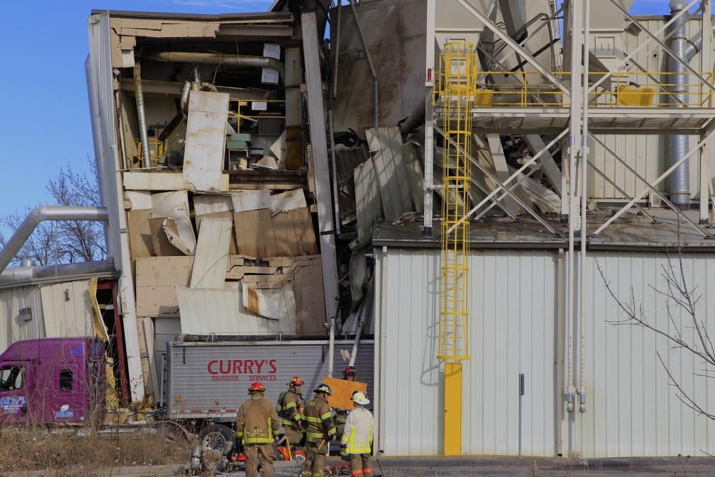 Firefighters outside the International Nutrition plant in Omaha on Monday. Photo: AP