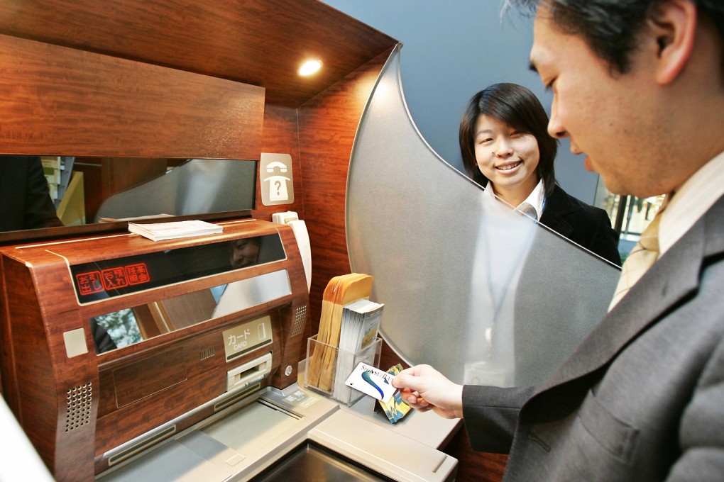 The ruling Liberal Democratic Party and its main ally in government, New Komeito, are planning to submit a bill to allow the government to access bank accounts that have not been touched for 10 years or more. Photo: AFP