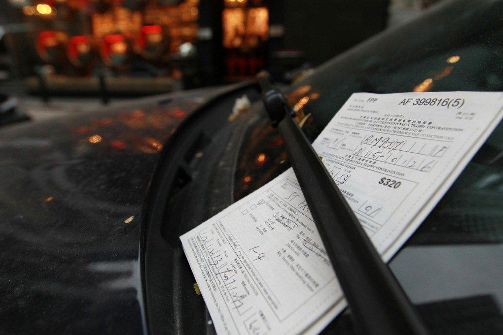 Penalty tickets are now hand-written by police officers. Photo: Dickson Lee