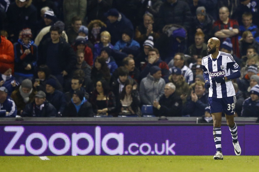 West Brom's Nicolas Anelka in front of their sponsor's advertising board during their  match against Everton at the Hawthorns. Photo: Reuters