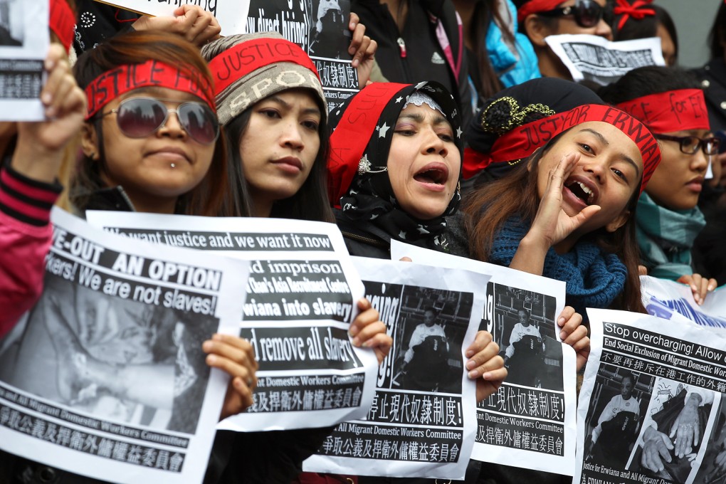 Protesters shout slogans to support Erwiana Sulistyaningsih during a march on Sunday. Teresa Liu Tsui-lan said most agencies bringing in Indonesian maids did not have a licence from the country. Photo: Nora Tam