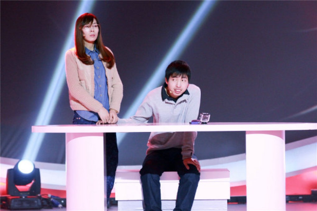 Zhou Wei was seen solving a calculation besides his older sister on reality show "The Strongest Brain". Photo: Xinhua