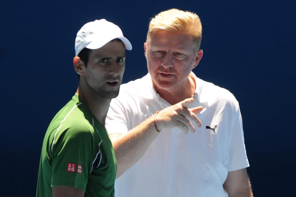 Serbia's Novak Djokovic takes advice from his new coach Boris Becker during a practice session at Melbourne Park. Photo: EPA