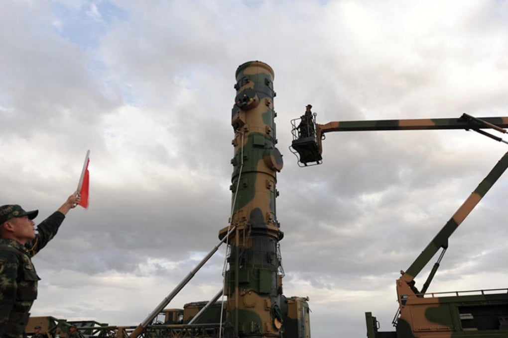 Photos published by the PLA Daily show for the first time members of the Second Artillery Forces launching a Dongfeng-31 missile. Photo: SCMP