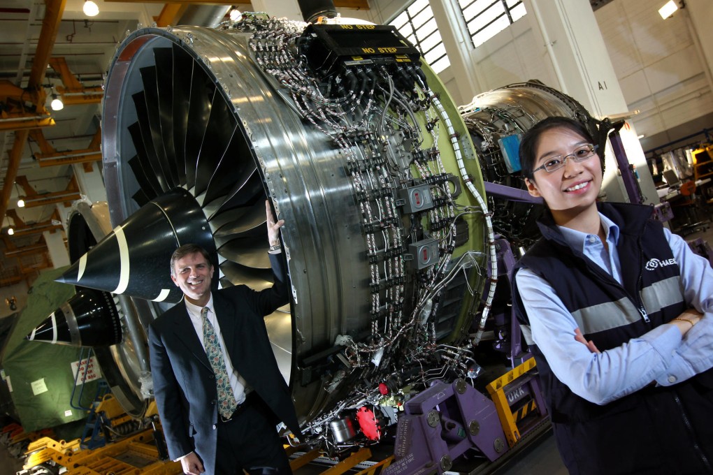 Richard Kendall (left) and Karina Mak Ka-wun with the Rolls Royce engine that will be the centrepiece of the fair. Photo: Nora Tam