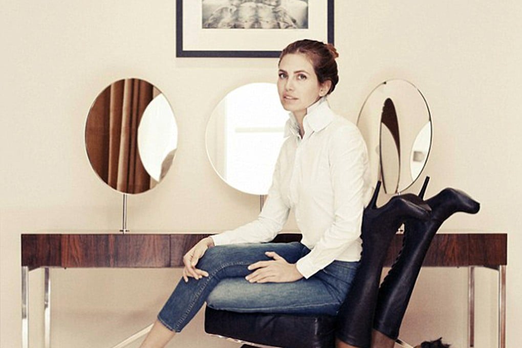 Dasha Zhukova poses on the chair fashioned from the contorted, near-naked mannequin of a black woman. Photo: SCMP Pictures