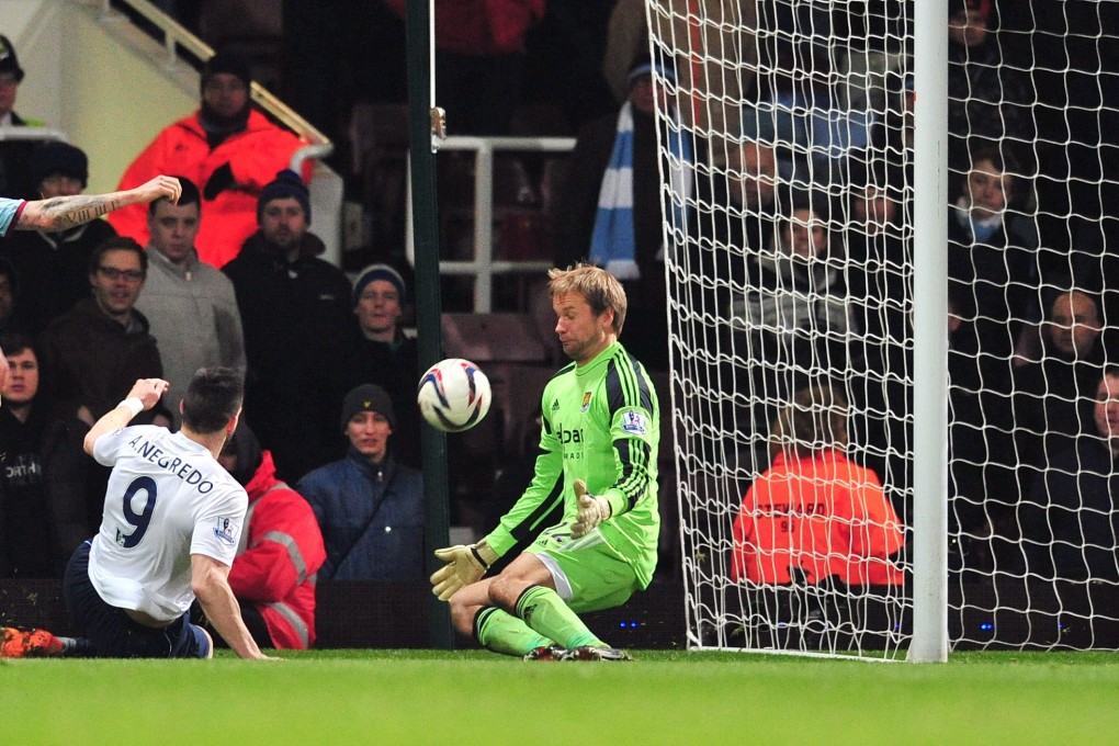 Manchester City's Alvaro Negredo scores his team's third goal against West Ham during the English League Cup semi-final second-leg match. Photo: AFP
