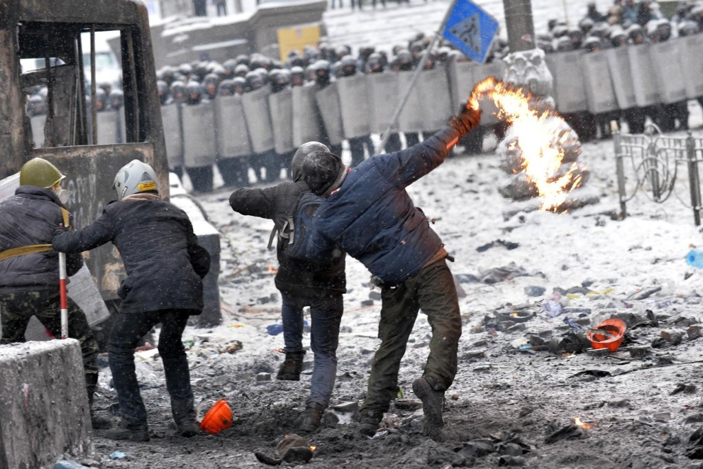 The scene in the centre of Kiev yesterday, where violent clashes erupted after police stormed protesters' barricades. Photo: AFP