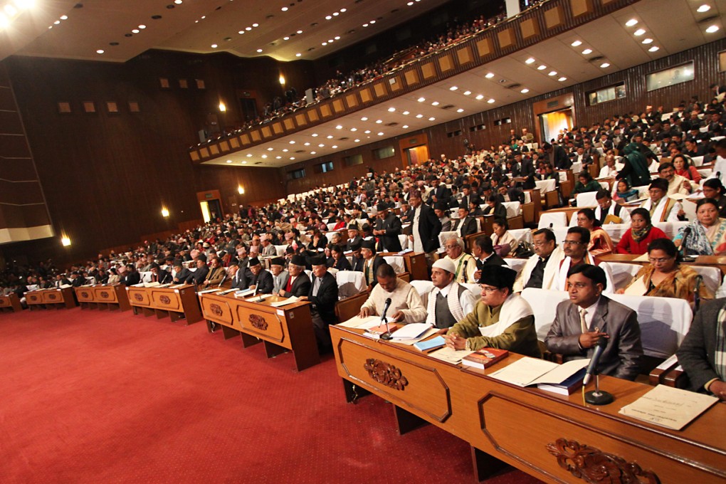 Newly elected lawmakers from various parties are seen during sworn in ceremony at the Constituent Assembly (CA) building in Kathmandu, Nepal. Photo: Xinhua