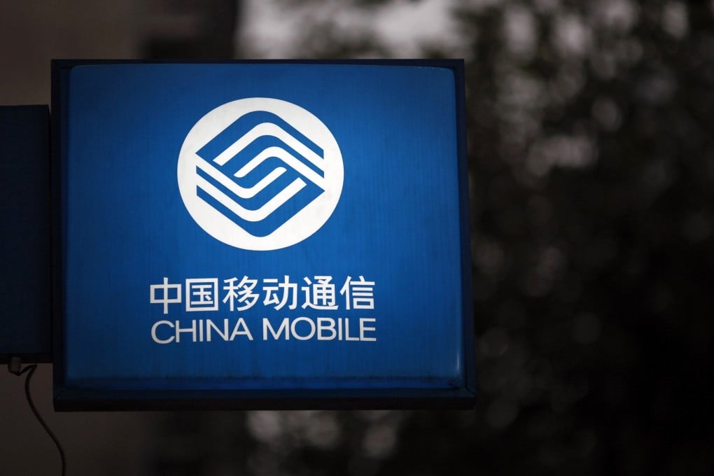 A sign with the logo of China Mobile is seen at a downtown area of Shanghai. Photo: Reuters