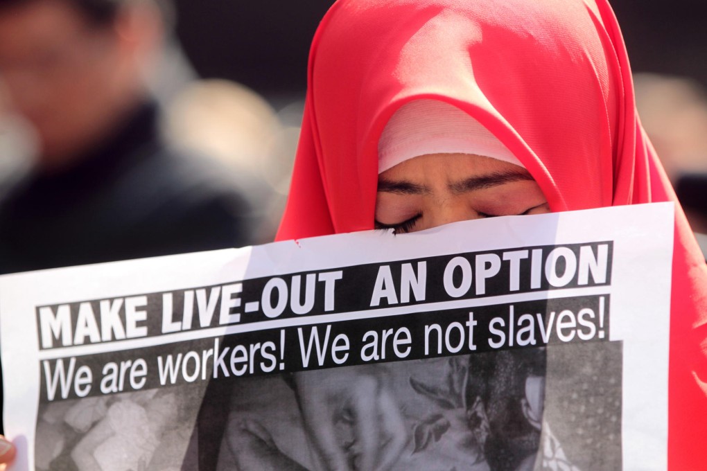 Demonstrators protest against the government's refusal to reconsider the live-in rule for foreign domestic helpers. Photo: Thomas Yau