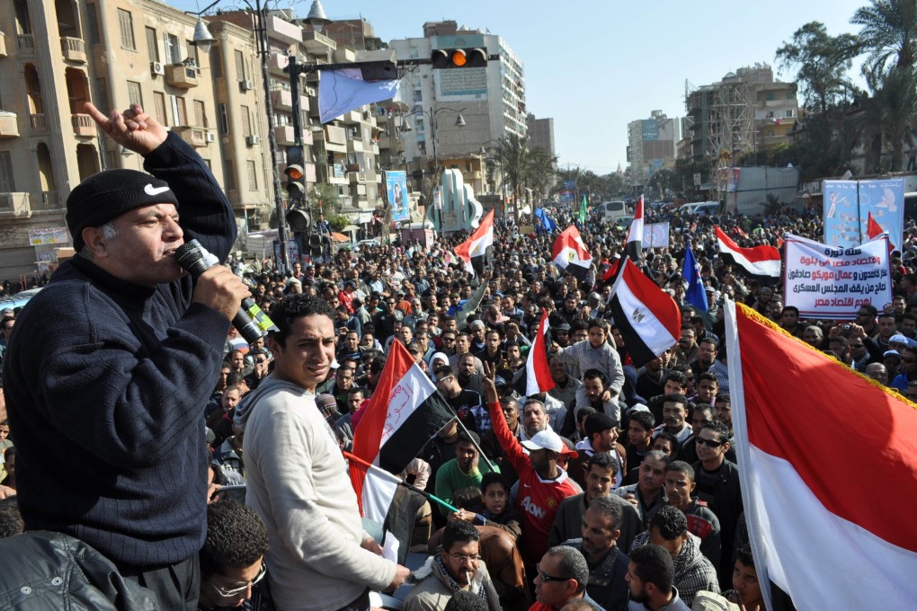 Egyptian protesters chant against the ruling military council during a rally in the city of Suez on the first anniversary of the country's revolt against ousted president Hosni Mubarak. Photo: AFP