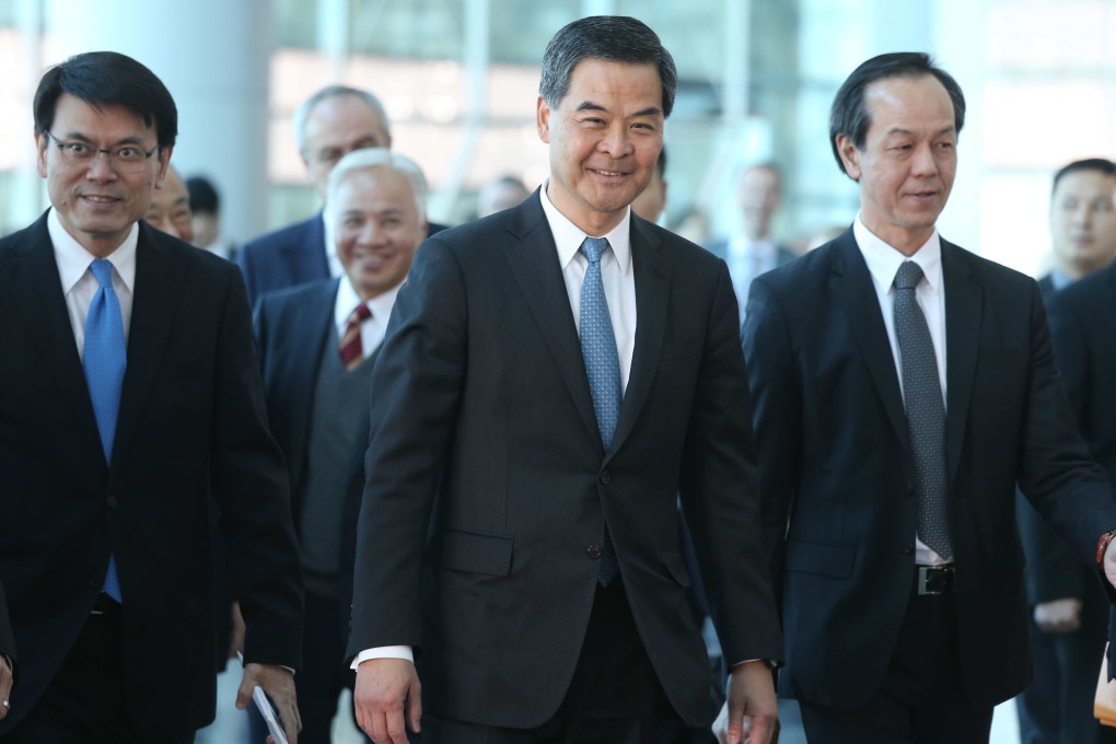 Chief Executive Leung Chun-ying meets business leaders accompanied by Edward Yau Tang-wah (left), director of the Chief Executive's Office. Photo: K.Y. Cheng