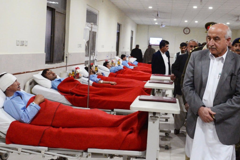 Pakistani Baluchistan province Chief Minister Abdul Malik Baloch (R) visits injured blast victims at a military hospital following an overnight bombing on a Shiite Muslim pilgrims bus, in Quetta. Spanish traveller Javier Colorado was heading towards Quetta when the attempted kidnapping took place. Photo: AFP