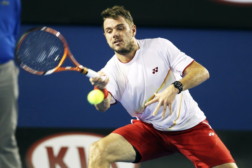 Stanislas Wawrinka of Switzerland hits a return during his semi-final match against Tomas Berdych of Czech Republic at the Australian Open on Thursday. Photo: Xinhua