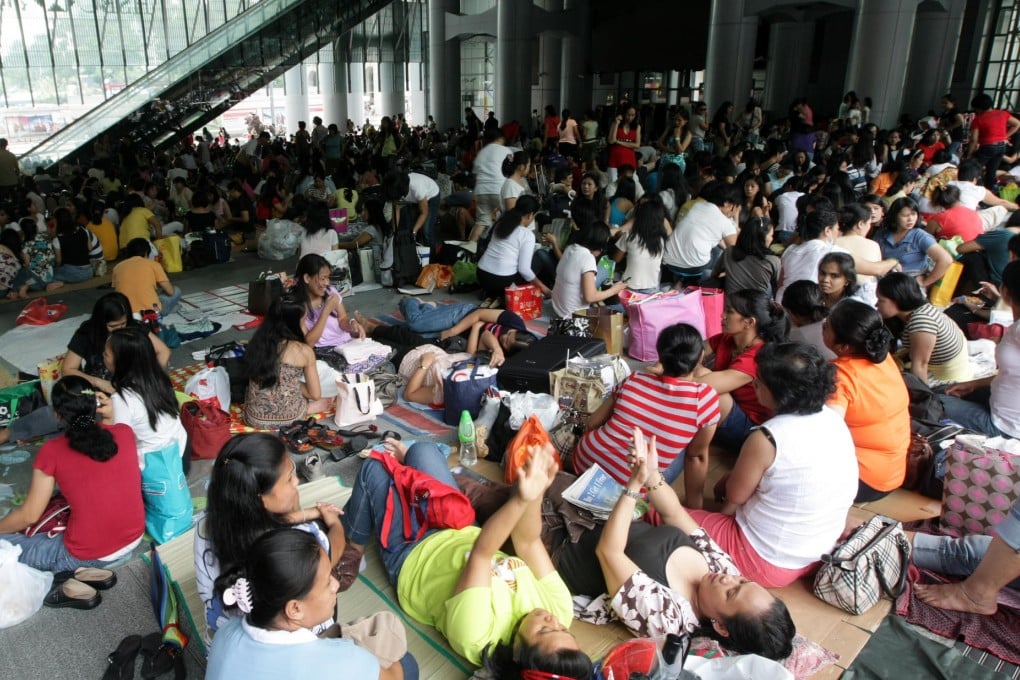 Helpers on their day off in Central. Photo: David Wong