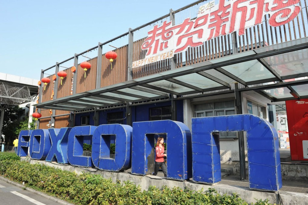 Former Foxconn executive detained in bribery investigation