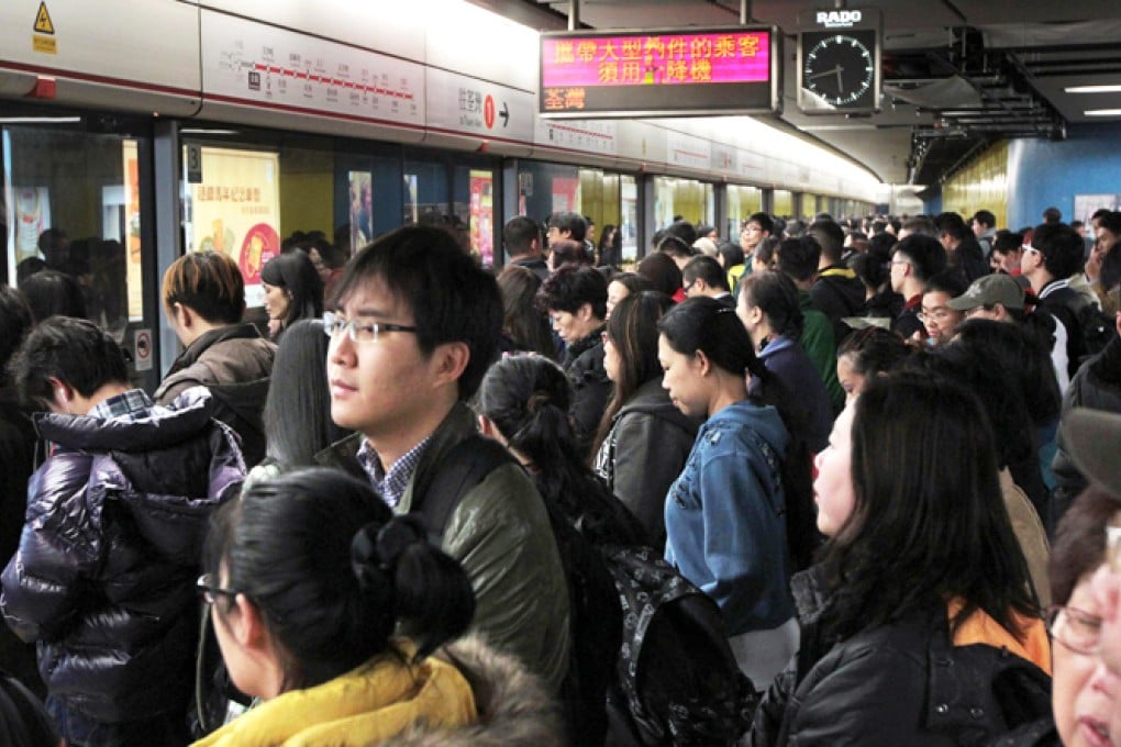 People wait at Admiralty station at rush hour. Photo: Thomas Yau
