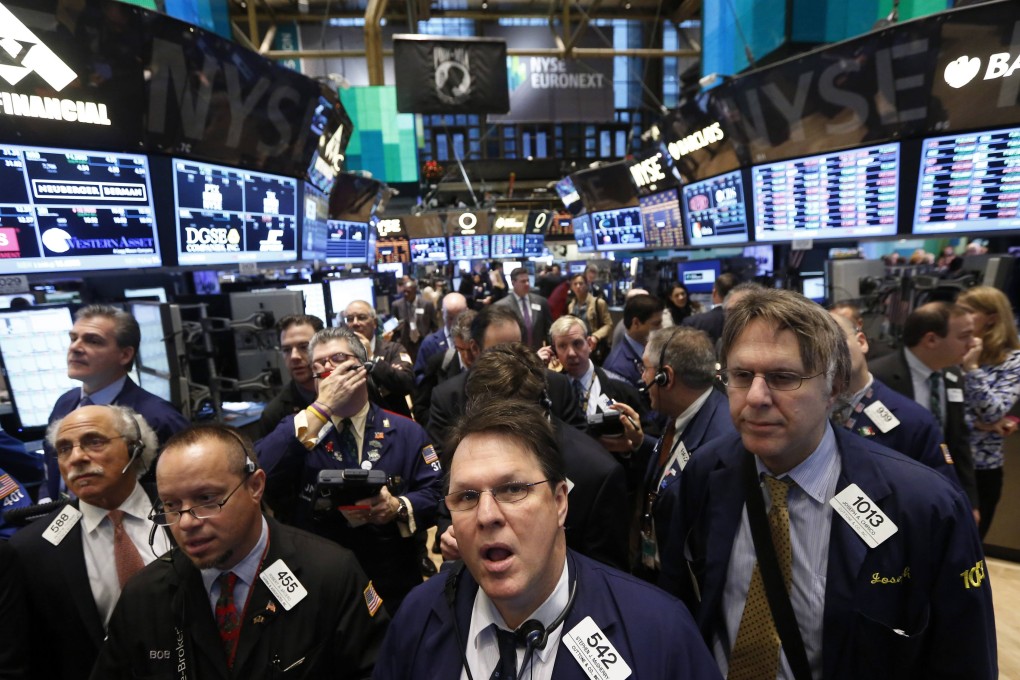 Traders work on the floor of the New York Stock Exchange.