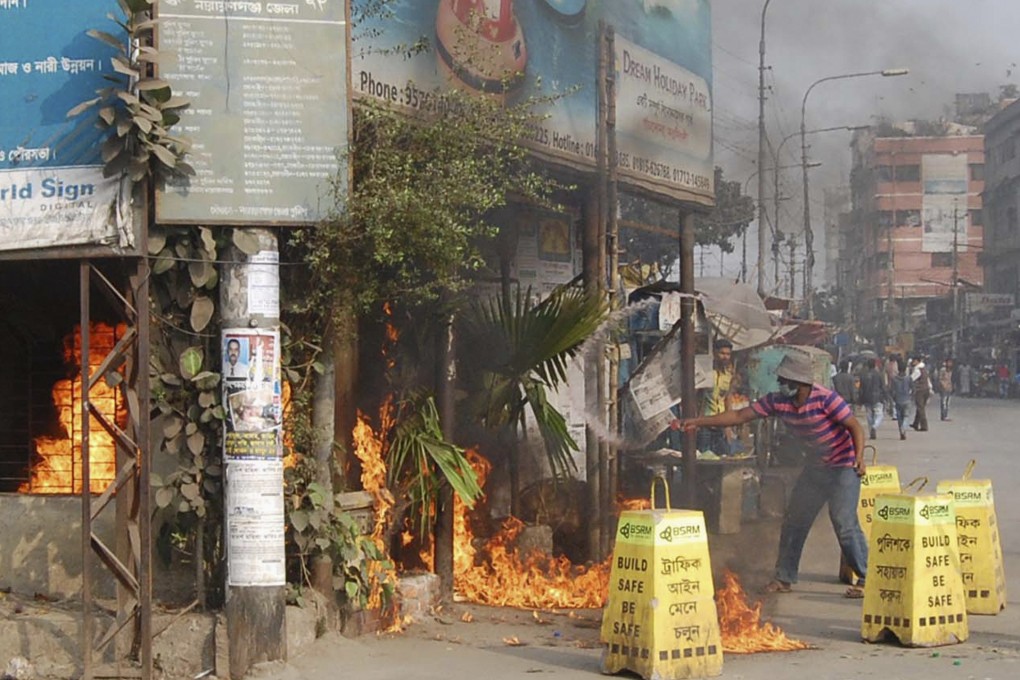 Bangladesh Jamaat-e-Islami activists set fire to an office of ruling party Bangladesh Awami League during a clash in Narayanganj earlier this month. Photo: Reuters