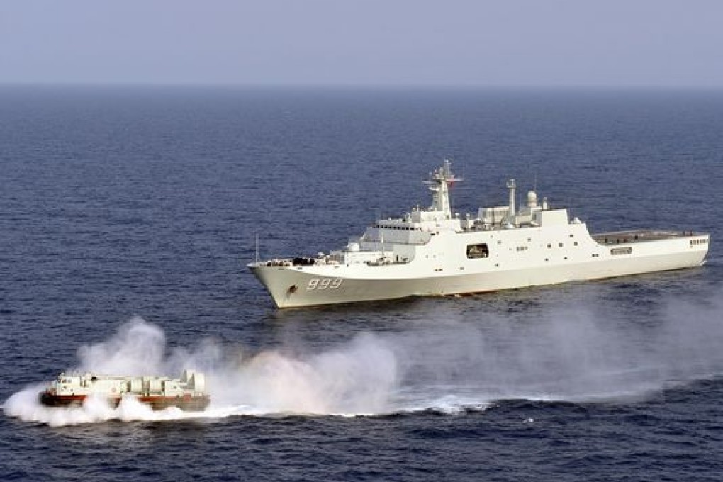 Chinese naval boats in the South China Sea. Three Chinese ships on Sunday patrolled the James Shoal, an area also claimed by Malaysia. Photo: AP
