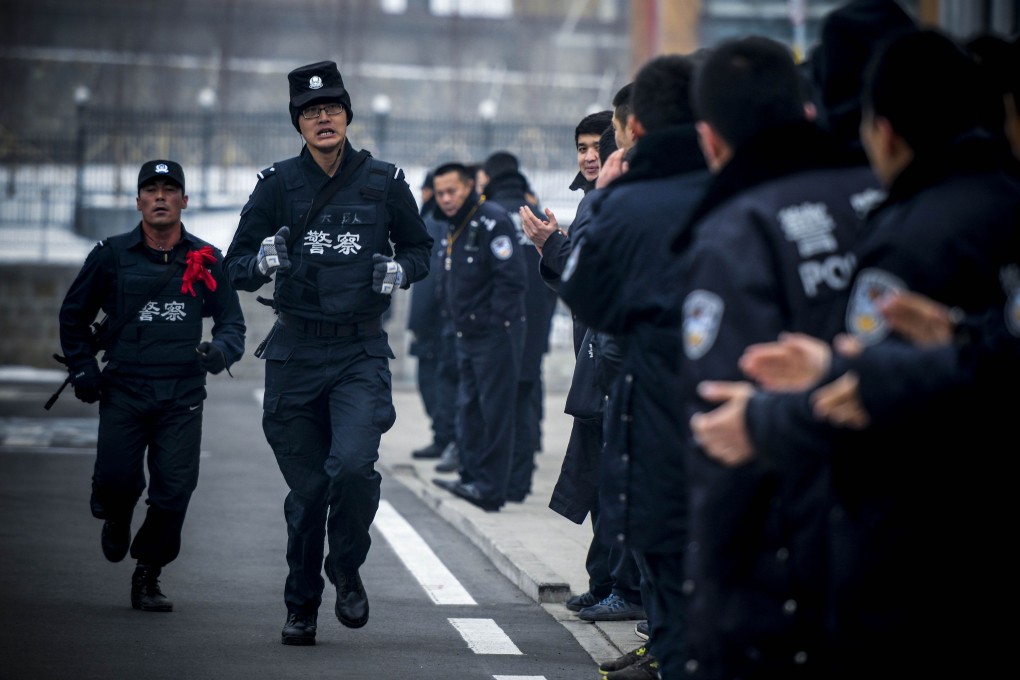 Police training session in Urumqi, northwest China's Xinjiang region. Police shot dead six people during a 'terrorist' attack in Xinjiang, and six more died after their explosives detonated. Photo: AFP