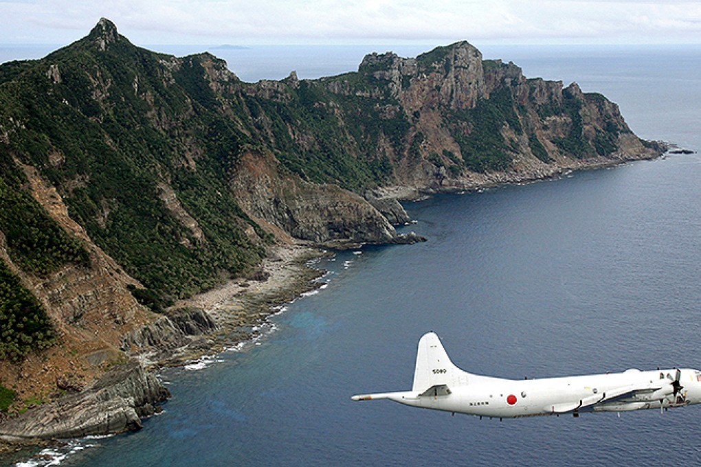 A Japanese surveillance plane flies over disputed islands in the East China Sea. Photo: AP